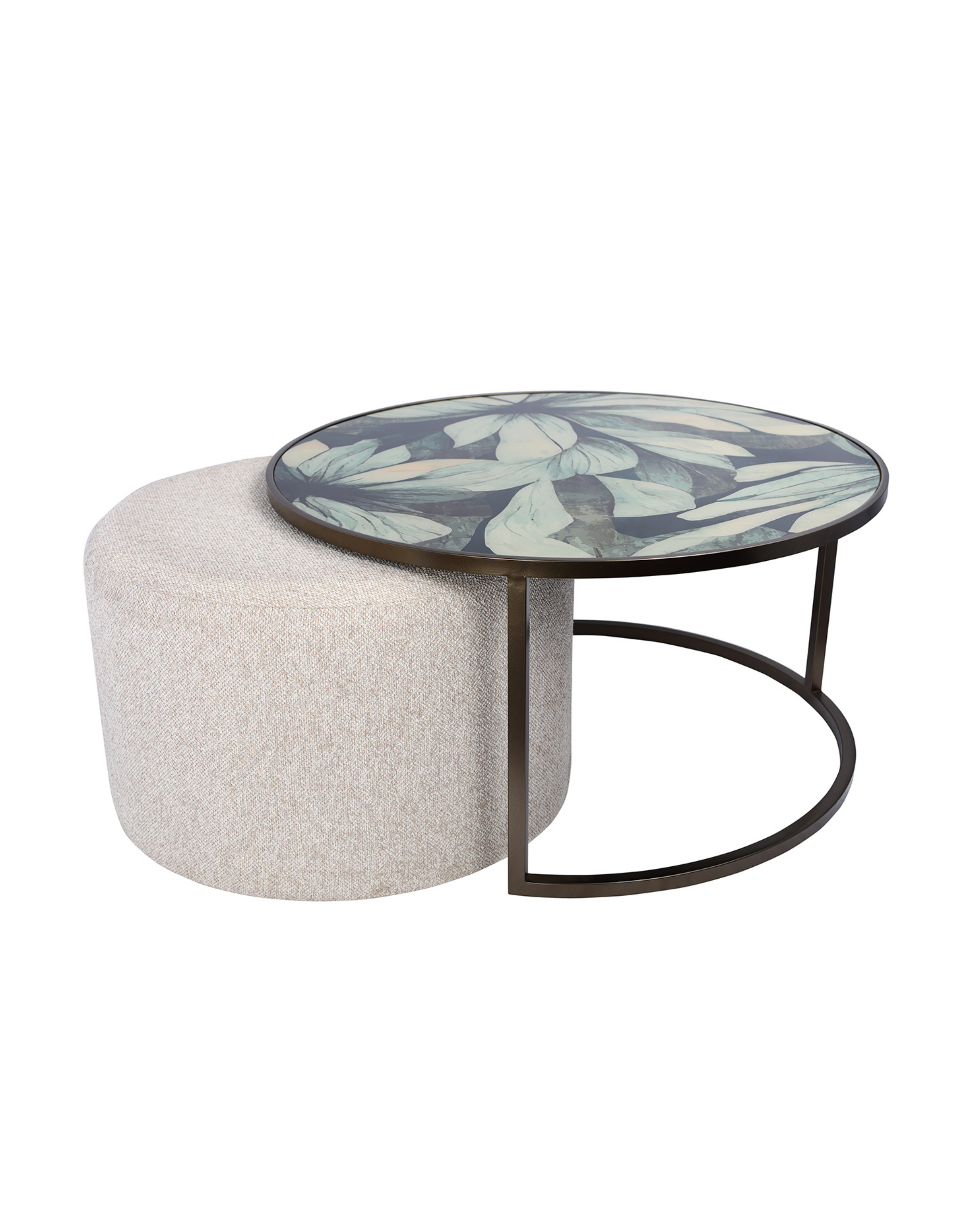 Round coffee table with floral design and white ottoman on a white background