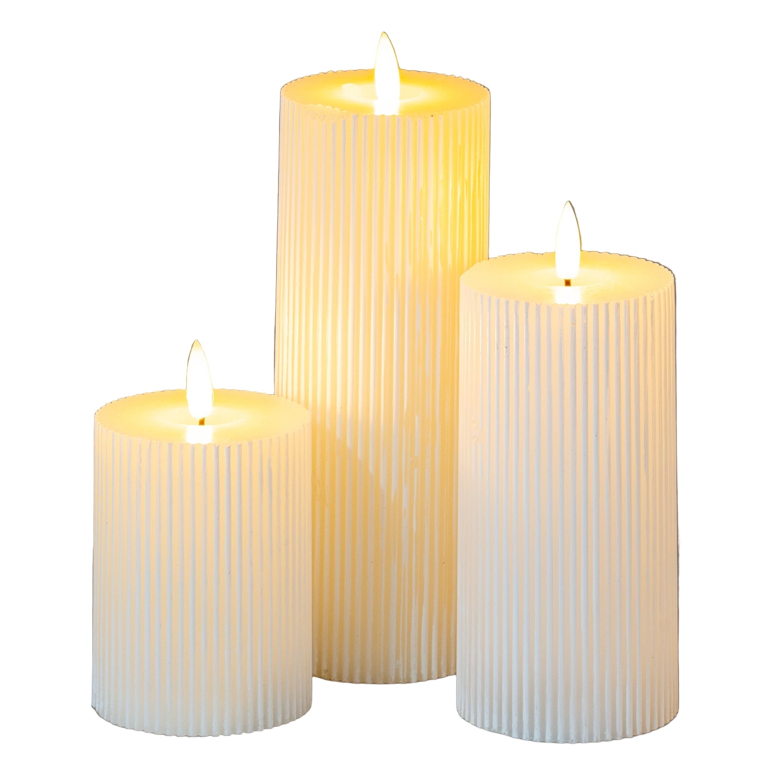 Three ribbed candles of different sizes on a gray background