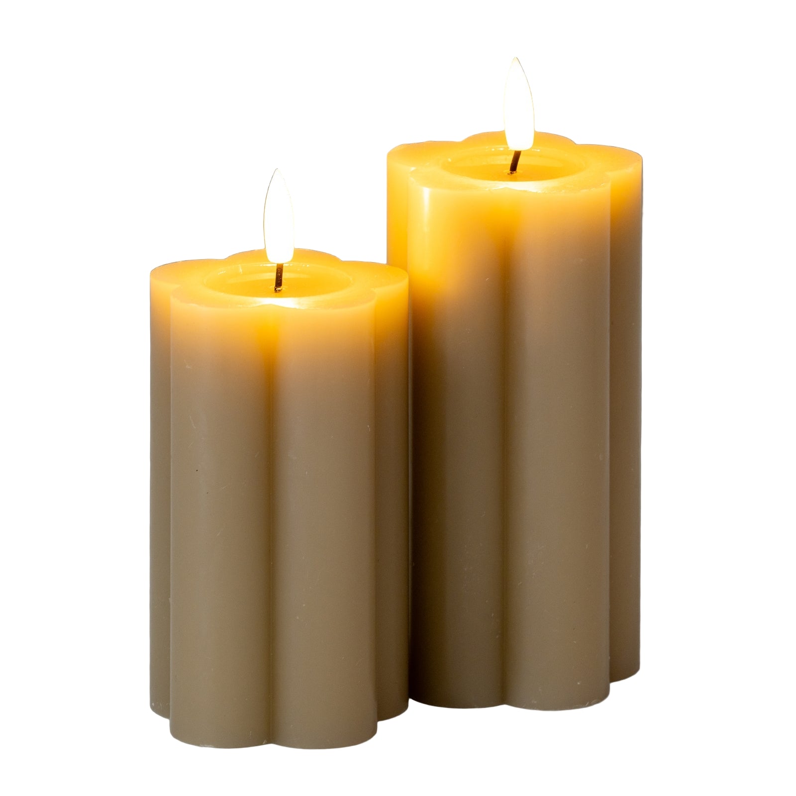 Two lit candles on a gray background