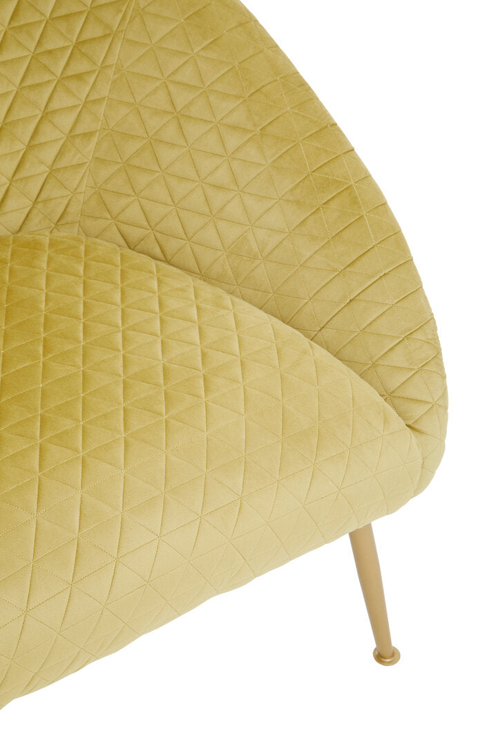 Close-up of a textured yellow chair with a white background
