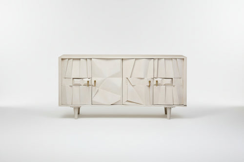 White cabinet with abstract design and gold handles on a white background