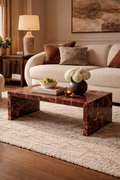 Living room with a marble coffee table, sofa, and decorative items.