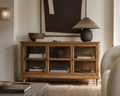 Wooden cabinet with glass doors in a living room setting