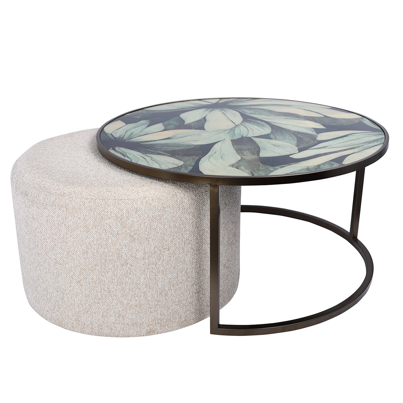 Round coffee table with floral design and white ottoman on a white background