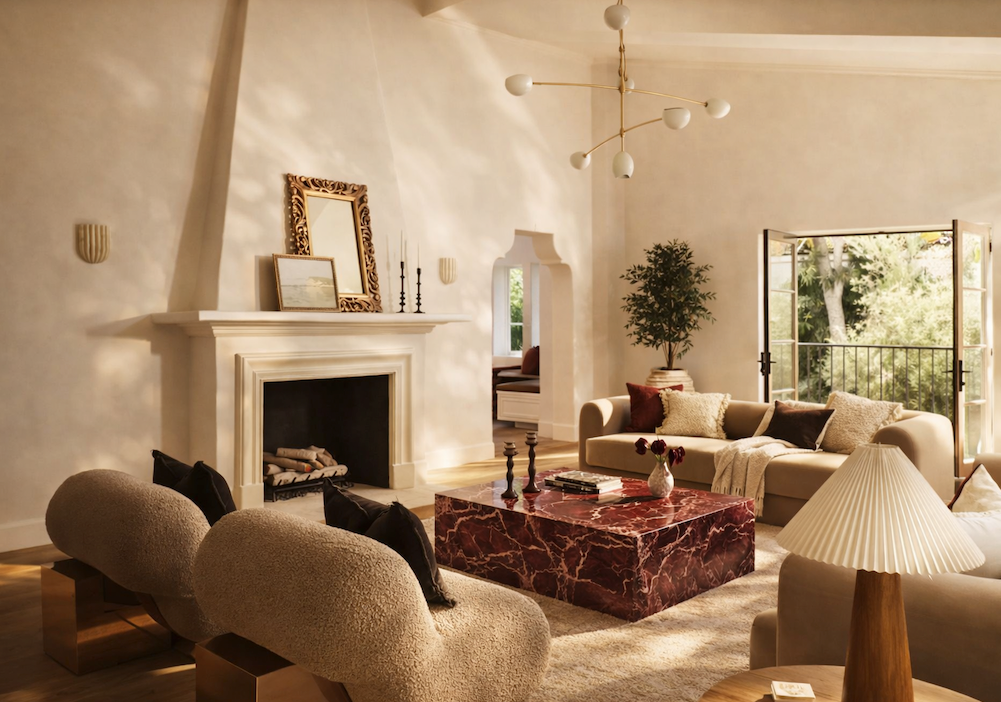 Luxurious living room with a fireplace, sofa, red marble coffee table and decorative items 