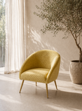 Yellow armchair in a bright room with a potted plant